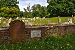 Cemetery plot with gravestone visibly missing