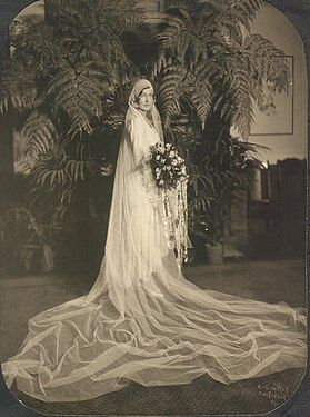 A bride in an elaborate wedding dress, US, 1929.