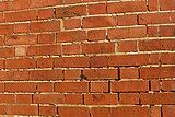 Defective pointing can allow rain to penetrate through masonry walls.