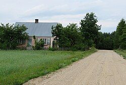 Houses by the unpaved road in Końskie Góry