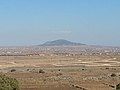 Tell al-Hara as seen from the Golan Heights to the west