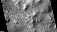 Layers just outside the rim of South crater in the form of "Swiss cheese", as seen by CTX camera (on Mars Reconnaissance Orbiter). Note: this is an enlargement of a previous image of east side of South crater.