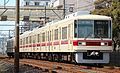 Set 8811 in February 2013 in revised livery with maroon stripes