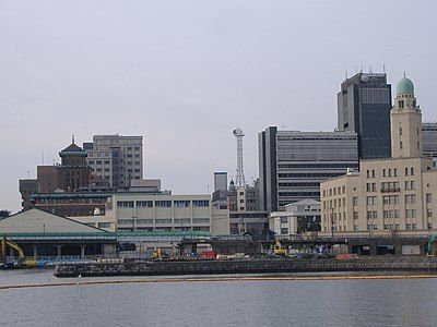 three building along a waterfront