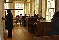 The restaurant's interior utilized wood furniture, seen here at the New York City location on opening day