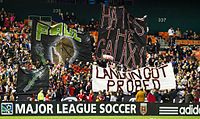 La Barra Brava display a tifo referencing the 2011 film Paul during a match against the L.A. Galaxy