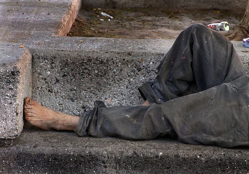 File:Homeless on bench.jpg