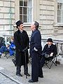 Actors in period costume sharing a joke whilst waiting between takes during location filming.