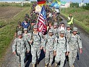 Eight Illinois guardsmen walk with Polish and German Soldiers during an annual pilgrimage from Warsaw to Czestochowa