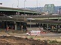 Truck on Forbes Avenue passing a ramp of the Birmingham Bridge in Bluff.