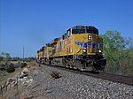 Three Union Pacific GEVOs about to cross the Arkansas River in Hutchinson, Kansas, in 2008