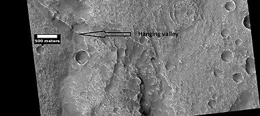 Hanging valley, as seen by HiRISE under HiWish program. This may have been a waterfall at one time.