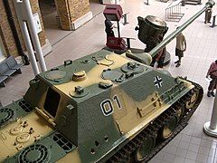 Jagdpanther equipped with the Nahverteidigungswaffe on the upper left side of the roof. Center left side of the roof.