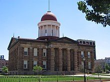 Color photo shows a domed building.