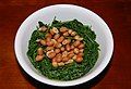 Boiled Kalimeris indica leaves served with salted peanuts