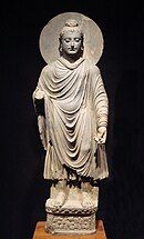 The Buddha, in Greco-Buddhist style, 1st-2nd century CE, Gandhara. (Standing Buddha (Tokyo National Museum)).