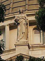 Statue of Themis, the goddess of justice, standing on the building of the Court of Final Appeal