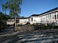 Municipal library. The new library building has been designed to fit in the environment of old wooden houses.