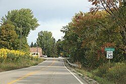 Looking north at the welcome sign for Sampson