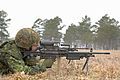 Jesse Mackenzie, from 1st Battalion, Nova Scotia Highlanders (North), adjusts the sights, on his C9, machine gun, at the range