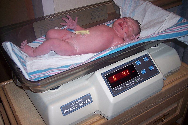 File:Baby being weighed.jpg