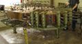 A Steinway solid wood piano case being pressed after taking from the steam box.