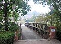 Pedestrian bridge over Slate Run creek heading towards Chambers Hall