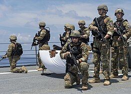 The VBSS team around the memorial.