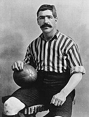 A black-and-white photograph of footballer Caesar Jenkyns, wearing a vertically stripped shirt.