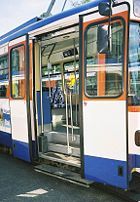 Entry door of a high-floor tram. Steps shown just inside the door.