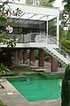 swimming pool with stairs to the balcony