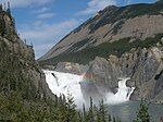 Waterfalls on a river, surrounded by granite peaks