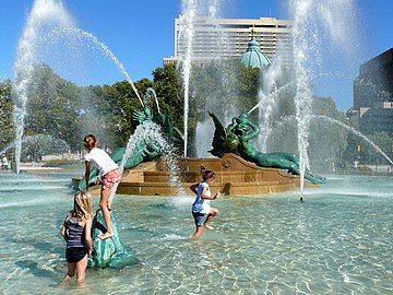 Children playing in the fountain