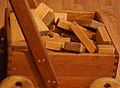 Image 5Wooden unit blocks, a type of toy block, in a wooden wagon (from List of wooden toys)