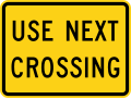 W10-14aP Use next crossing (plaque)