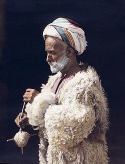 Man spinning wool