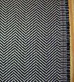 Example of the herringbone pattern, a popular choice for suits and outerwear