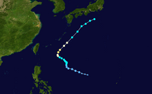 A track map showing the path of a typhoon over the western Pacific Ocean. The system moves to the west-northwest at first, then drifts to the north before resuming its west-northwestward motion. It then shifts to the northeast, a motion it maintains until dissipation just south of Japan.