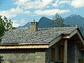 Image 42Alpine chalet being built in Haute-Maurienne (Savoy), the use of thick pieces of orthogneiss (4–7 cm) is by the strict architectural regulations in the region bordering the national parks of Vanoise-Grand Paradis. (from Alps)