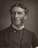 Monochrome photograph of the poet Matthew Arnold with centre parting and sideburns