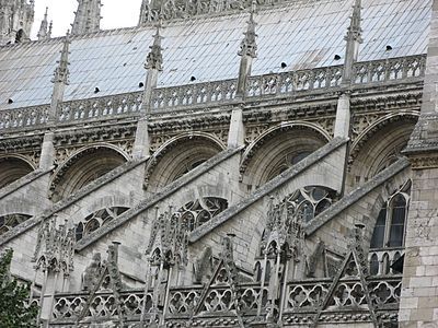 The buttresses and decoration of the roofline of the nave