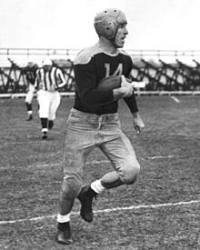 Hutson catching a football in his uniform