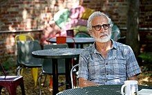 Jamie Kalven sitting at an outdoor patio