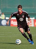 Santino Quaranta dribbles a ball during a match against AFC Ajax at RFK Stadium