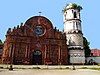 Facade and the cylindrical belltower of Tumauini