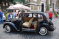 Fiat 1100 Berlina; the body is pillarless and has backwards-opening rear doors