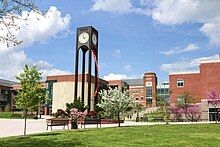 The lower quad of Frostburg State University in spring featuring the Clock Tower with CCIT and Compton Science Center in the background.