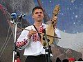 A boy playing the folk string instrument gadulka