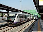 A Piraeus-Corinth train made of two Desiro DMU-2s and a single Staedler GTW/2 railbus for the Piraeus-Airport suburban service stand at Piraeus railway station, Greece, in 2007