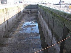 Lock emptied for maintenance – high water end of the lock.